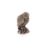 A modern silver owl,maker's mark of CN, London 1976,modelled standing on a rocky base, the reverse