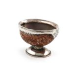 An 18th century silver-mounted cowrie shell salt cellar,unmarked, circa 1770,the mount with a