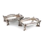 By Omar Ramsden, a matched pair of Arts and Crafts silver salt cellars,London 1931 and 1932, one