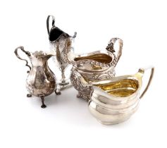 A small collection of four George II and George III silver cream jugs, comprising: one of baluster
