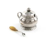 By Georg Jensen, a Danish silver mustard pot and horn spoon,design numbers 190 and 130, with
