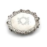 A George III silver waiter,by Ebenezer Coker, London 1760,circular form, shell and scroll border,