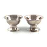 By the Birmingham Guild of Handicraft, a matched pair of Victorian Arts and Crafts silver bowls,