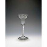 A good wine glass of probable Jacobite significance, c.1750, the pan-topped bowl engraved with a