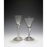 Two wine glasses, c.1740-50, with drawn trumpet bowls, one on a spiral mercury twist stem, the other