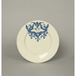 A Delft plate, dated 1690, painted in blue with two griffins flanking a cartouche enclosing the