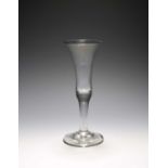 An ale glass, c.1730-40, with slender bell bowl rising from a plain stem over a conical foot, 20.