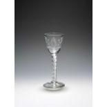 A small wine glass of possible Jacobite significance, c.1760, the round funnel bowl engraved with