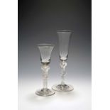 A wine glass and an ale glass, mid 18th century, the wine with a bell bowl, the ale with a slender