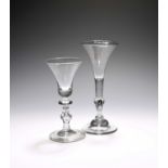 Two balustroid wine glasses, c.1730-40, one of Kit Kat type with a drawn trumpet bowl rising from
