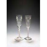 Two ale glasses, c.1760, with slender funnel bowls, one partially moulded with vertical flutes, both