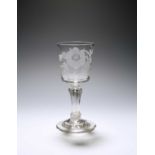 A rare Jacobite goblet, c.1740, the generous bucket bowl engraved with a bird in flight beside a