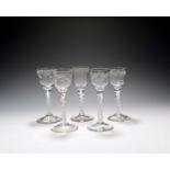 Five wine glasses, c.1750-70, with ogee bowls, one of possible Jacobite significance engraved with a