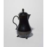 A Jackfield coffee pot and cover, c.1760, the pear-shaped body decorated in a lustrous black