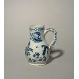 A Delft jug or tankard, late 17th century, of baluster form, painted with Chinese figures seated