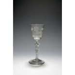 A rare Hanoverian wine glass, c.1760, the round funnel bowl engraved with the white horse of Hanover