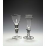 Two pedestal stem glasses, c.1720-30, one with a conical bowl with solid base raised on a hollow