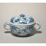 A Delft broth bowl or milk tureen and cover, c.1690, the circular form painted in blue with