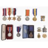 A small quantity of medals and militaria, comprising: four medals to Sergeant R.G.A. Hill, South
