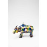 A CHINESE EGG AND SPINACH GLAZED MODEL OF A WATER BUFFALO20TH CENTURYStanding four square with a boy