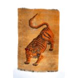 A TIBETAN TIGER RUGLATE QING DYNASTYDecorated with a large tiger with its tail raised and its head