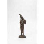 AN INDIAN BRONZE STANDING FIGURE OF A GODDESS19TH CENTURYWith her head tilted to one side and her