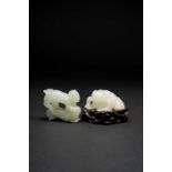 A CHINESE WHITE JADE CARVING OF A TOAD AND A JADE CARVING OF THE TWIN BOYS, 'SIXI TONGZHI'QING