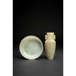 A CHINESE CELADON JADE VASE AND A JADE DISHLATE QING DYNASTYThe vase with a flattened ovoid body