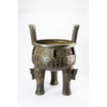 A MASSIVE CHINESE BRONZE ARCHAISTIC DINGMODERNAfter a Zhou dynasty original, the rounded bowl cast