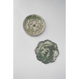 TWO CHINESE SILVERED BRONZE MIRRORSTANG DYNASTYOne cast in relief with birds, animals and berries,