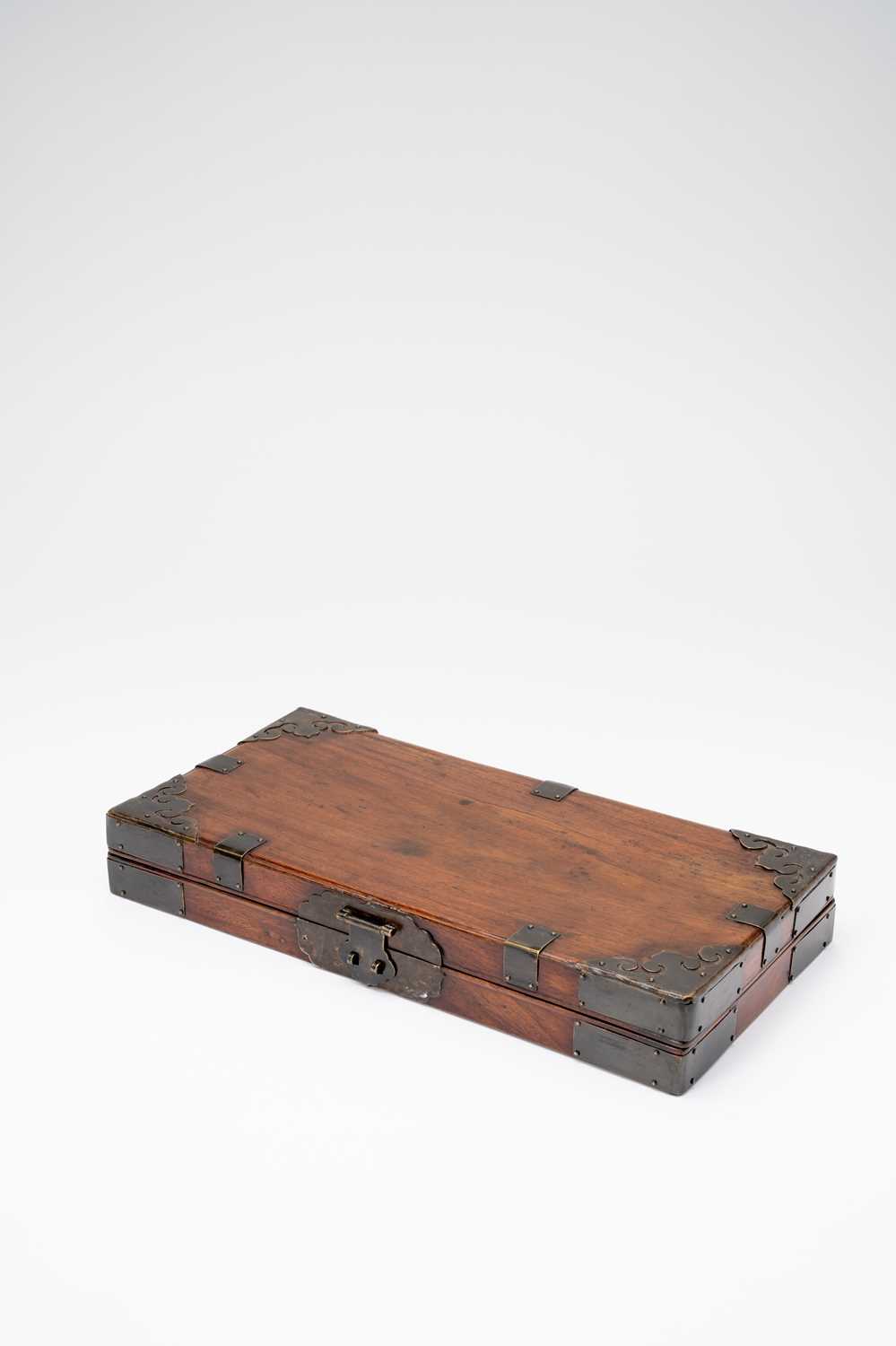 A CHINESE HARDWOOD RECTANGULAR SUTRA BOXQING DYNASTYWith a hinged lid, and mounted with metal