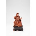 A CHINESE SOAPSTONE CARVING OF GUANDILATE QING DYNASTYThe God of War depicted in a terracotta