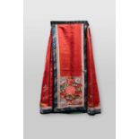 A CHINESE SILK SKIRTLATE QING DYNASTYDecorated with embroidered panels of flowers, leaves and