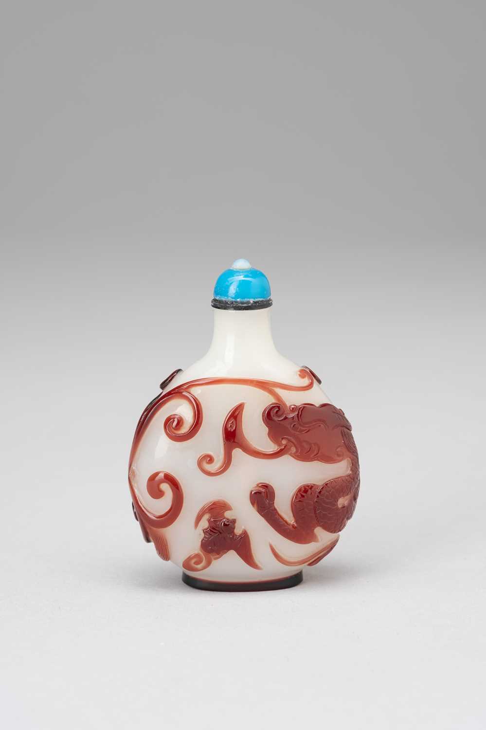 A CHINESE RED OVERLAY GLASS ‘DRAGON’ SNUFF BOTTLEQIANLONG 1736-95Attributed to the Beijing Palace