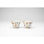 A PAIR OF CHINESE FAMILLLE ROSE 'BUTTERFLY' BOWLS20TH CENTURYThe exteriors brightly enamelled with