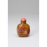 A CHINESE AGATE SNUFF BOTTLE1770-1840The honey-coloured stone finely carved with the Demon