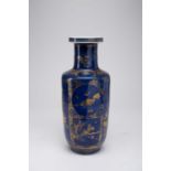 A CHINESE GILT-DECORATED BLUE-GROUND ROULEAU VASELATE QING DYNASTYThe cylindrical body decorated