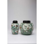 TWO CHINESE FAMILLE VERTE VASESLATE QING DYNASTYPainted with panels containing flowers, trees and