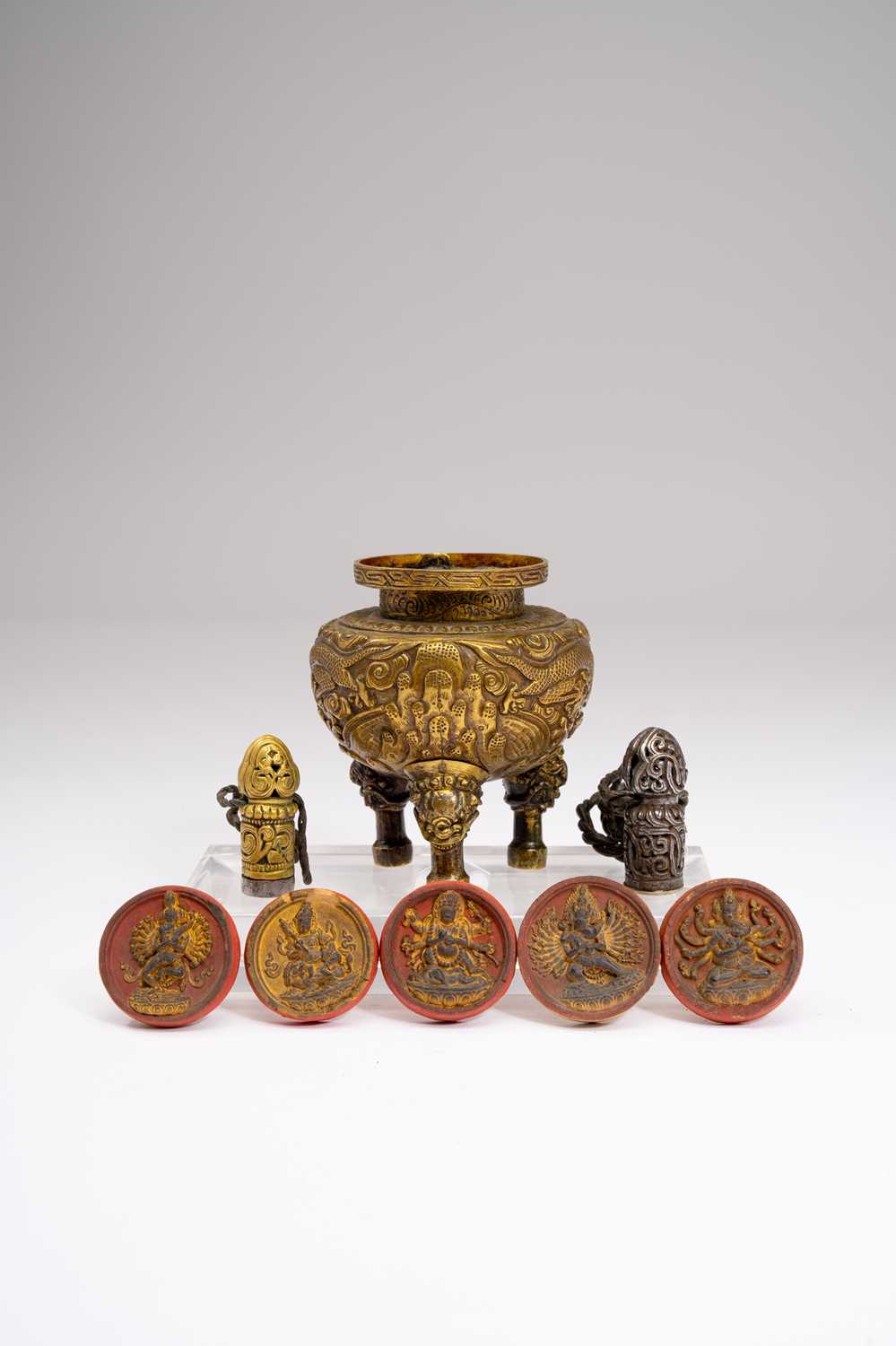 VARIOUS TIBETAN ITEMS18TH CENTURY AND LATER Comprising: five Tibetan circular moulded and painted