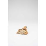 A SMALL CHINESE SOAPSTONE CARVING OF LI BAI17TH/18TH CENTURYThe drunken poet depicted reclining with