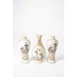 THREE CHINESE FAMILLE ROSE VASES 18TH CENTURYWith moulded bodies painted with panels containing Magu