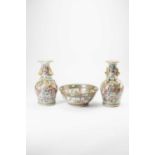 A PAIR OF CHINESE CANTON FAMILLE ROSE VASES AND A BOWL 19TH AND 20TH CENTURYTypically decorated with