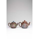 TWO CHINESE YIXING TEAPOTS AND COVERS18TH AND 19TH CENTURYBoth decorated in famille rose enamels