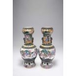 A LARGE PAIR OF CHINESE FAMILLE ROSE CRACKLE-GROUND VASES19TH CENTURYThe bodies painted with