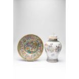 A CHINESE CANTON FAMILLE ROSE BOWL AND A BALUSTER VASE AND COVER18TH AND 19TH CENTURYThe bowl