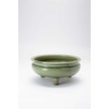 A CHINESE LONGQUAN CELADON TRIPOD INCENSE BURNERMING DYNASTYThe shallow rounded bowl with an everted