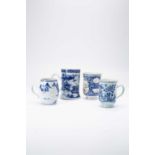 FOUR CHINESE BLUE AND WHITE MUGS18TH CENTURYTwo painted with pagoda landscapes, one with flowers and
