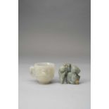 A CHINESE JADE 'PRUNUS' CUP AND A JADE FIGURE OF A HORSE AND A BOYQING DYNASTYThe cup with a