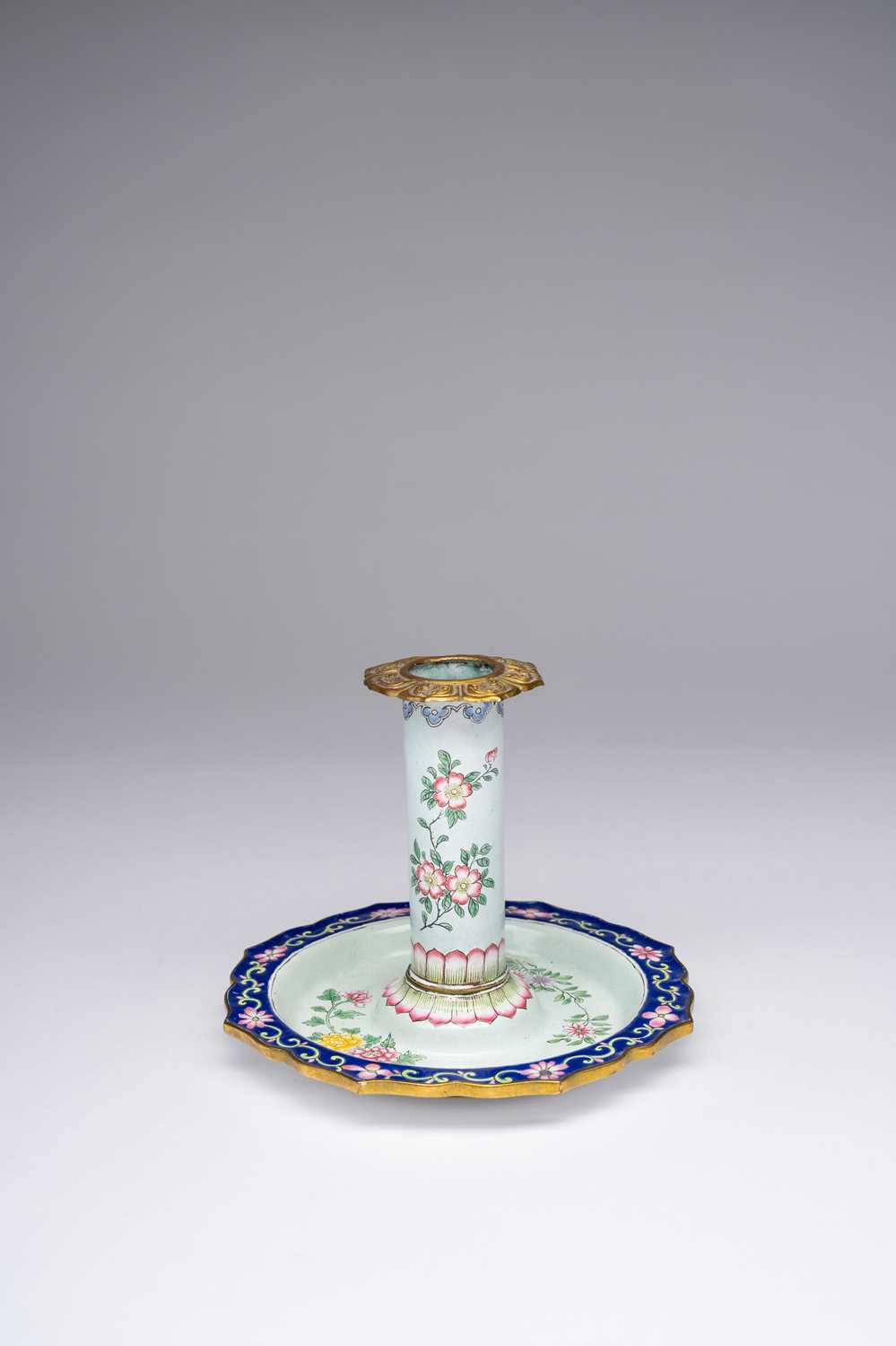 A CHINESE ENAMEL CHAMBER-STICK 18TH/19TH CENTURYFinely painted with flower sprays on a pale green
