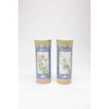 A PAIR OF CHINESE FAMILLE ROSE CYLINDRICAL VASES 19TH CENTURYPainted with panels of birds perched in